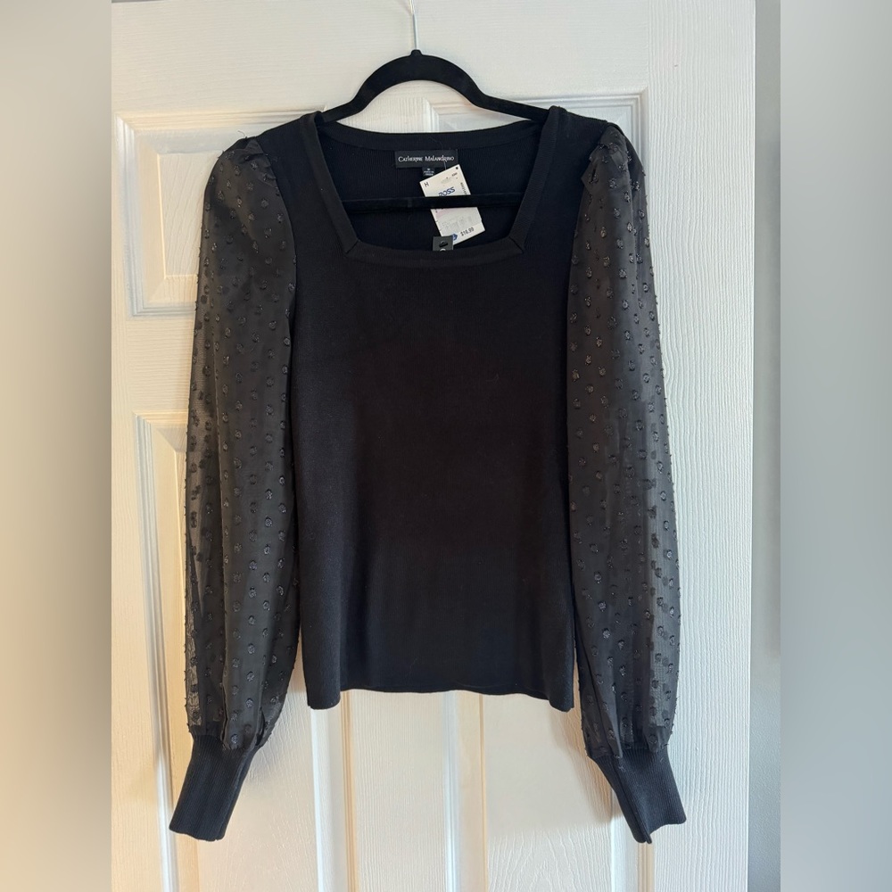 Black sweater, polkadot sleeve